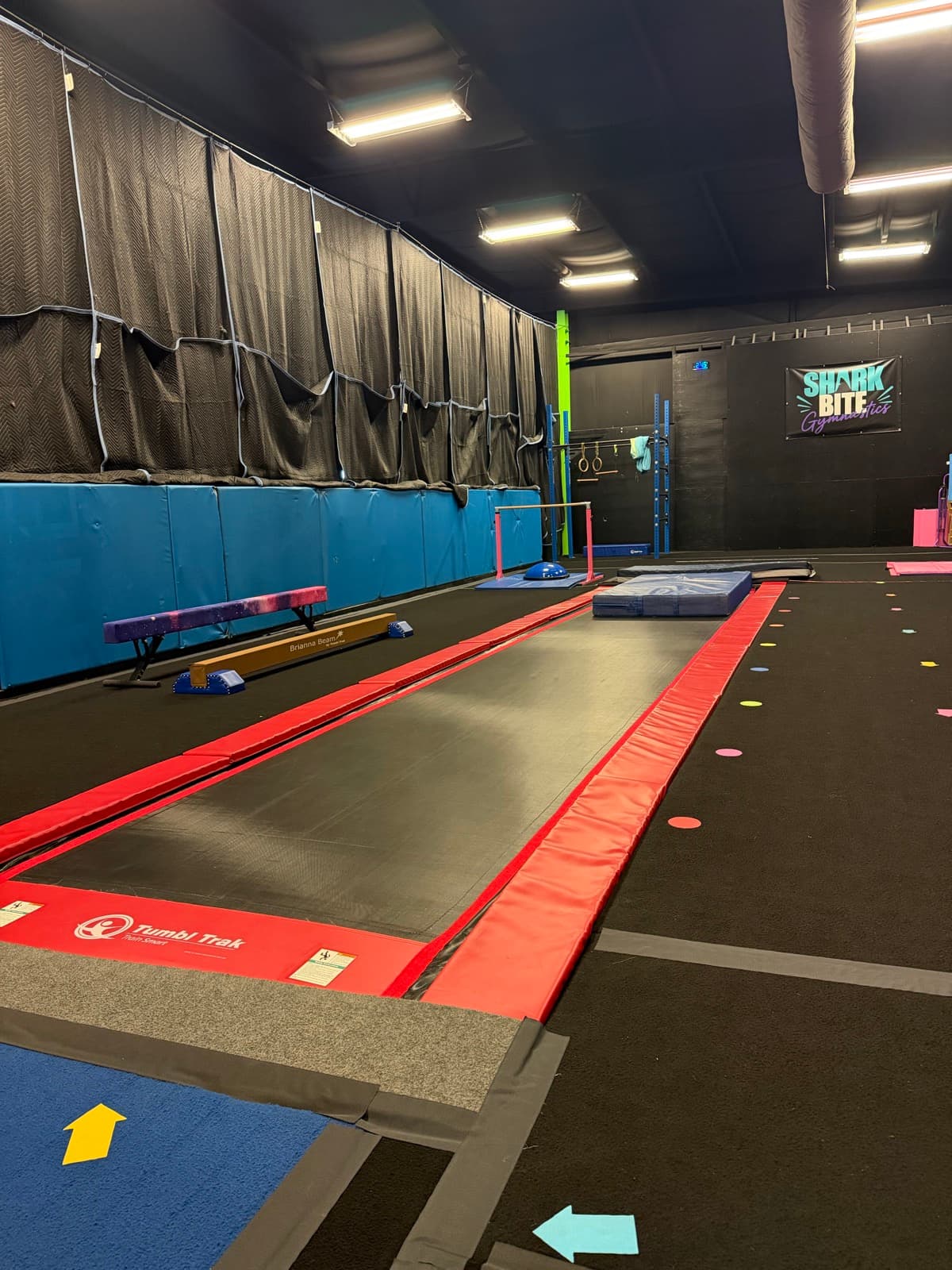 The gymnastics floor with the tumble track and the big wedge mat, ready for class